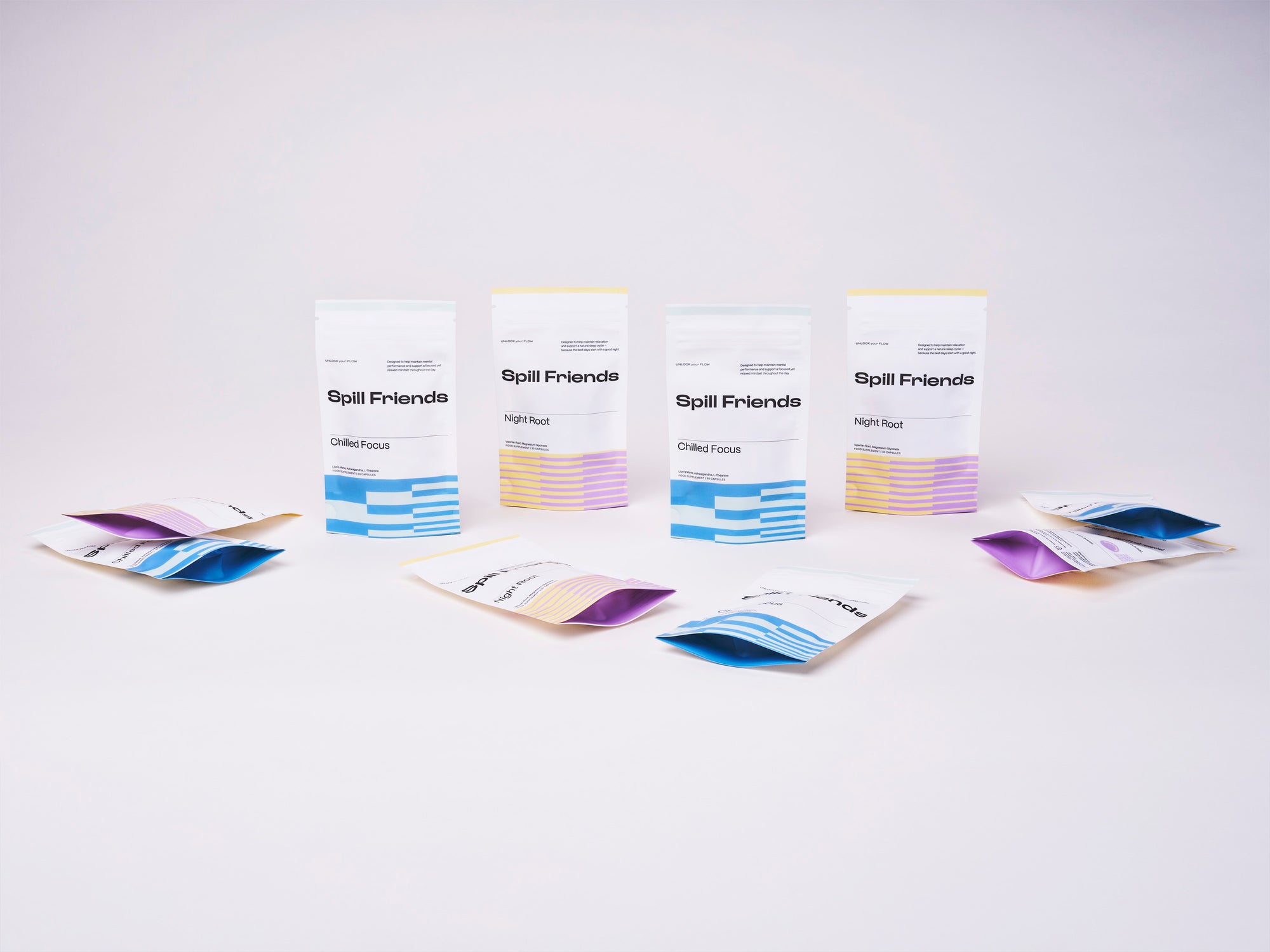Spill Friends product range – Night Root and Chilled Focus pouches with opened packs arranged on white studio set.